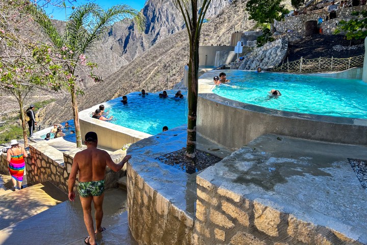 a group of people in a pool of water