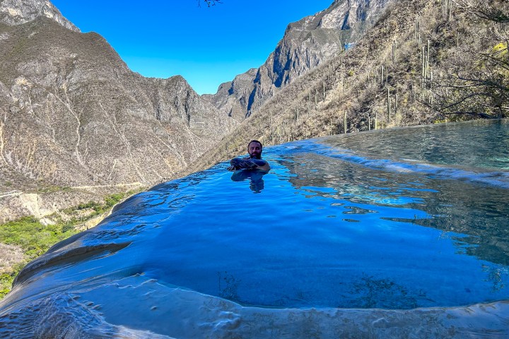 a person riding on top of a mountain