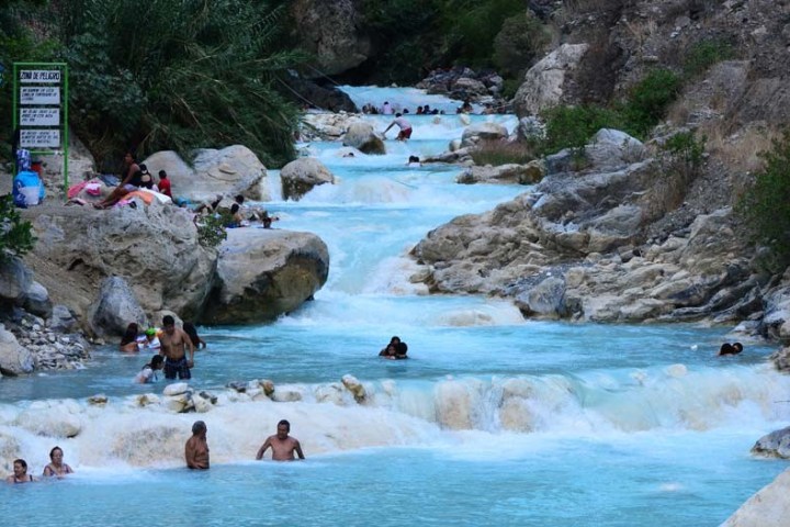 a group of people swimming in a body of water