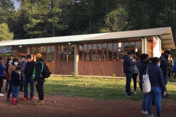 a group of people standing in a yard