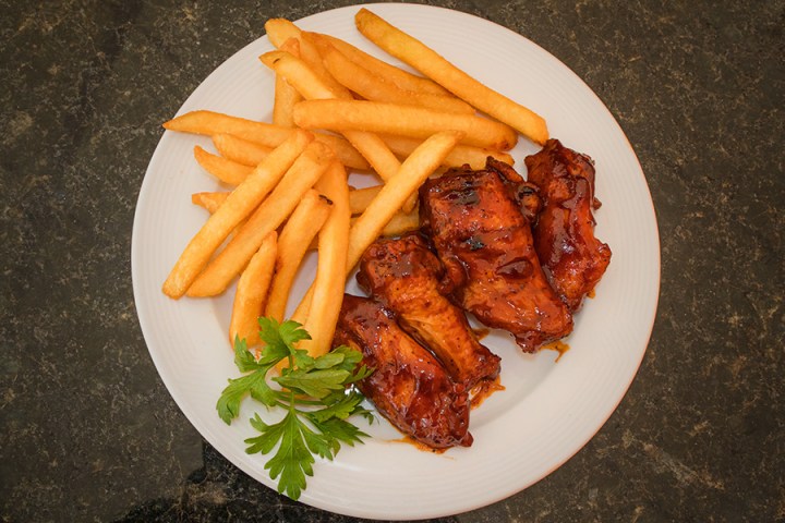 a chicken sandwich and fries on a plate