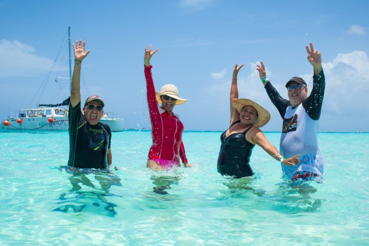 a group of people swimming in a body of water
