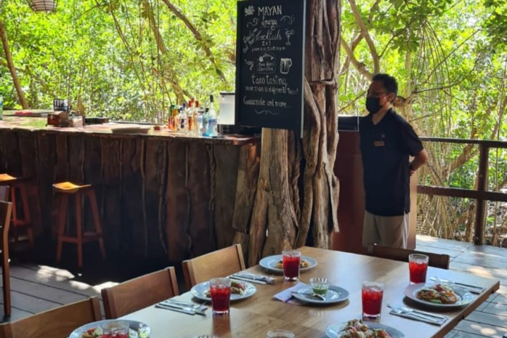 a group of people sitting at a dining table