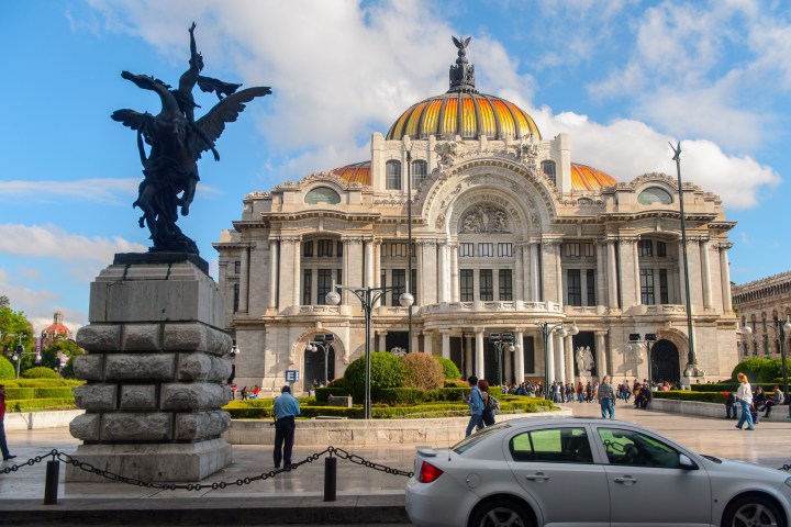 a group of people standing in front of a building