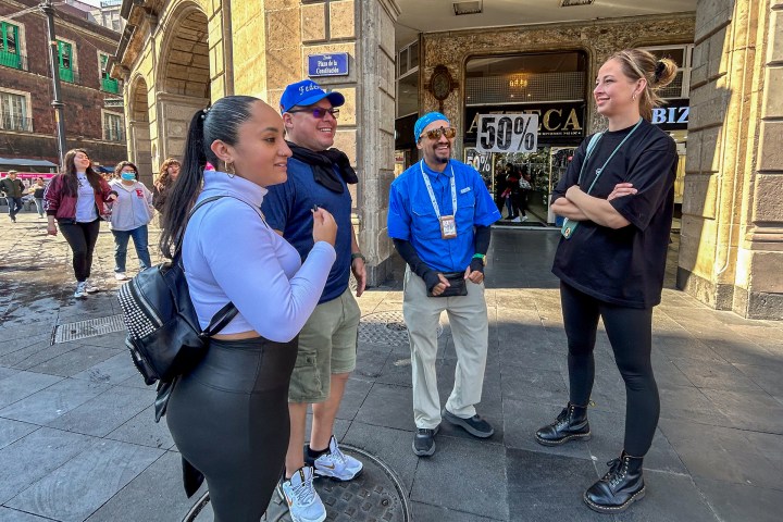 a group of people standing in front of a building