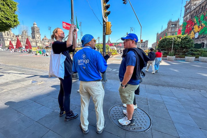 a group of people walking down the street