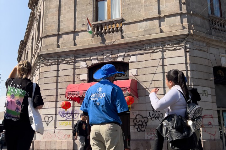 a group of people standing in front of a building