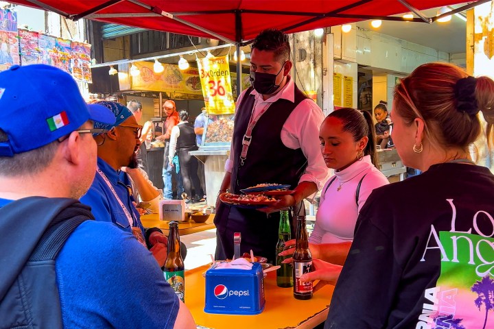 a couple of people that are standing in a store