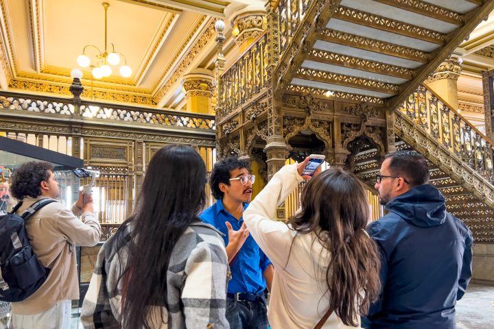 a couple of people that are standing in front of a building