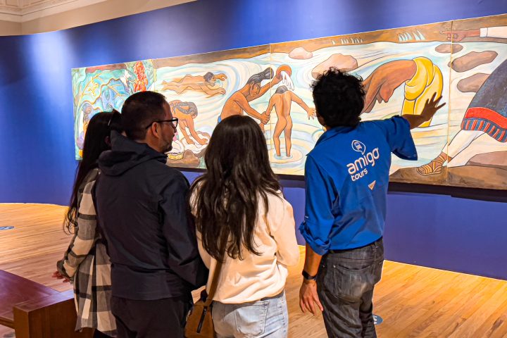 a group of people standing in front of a television