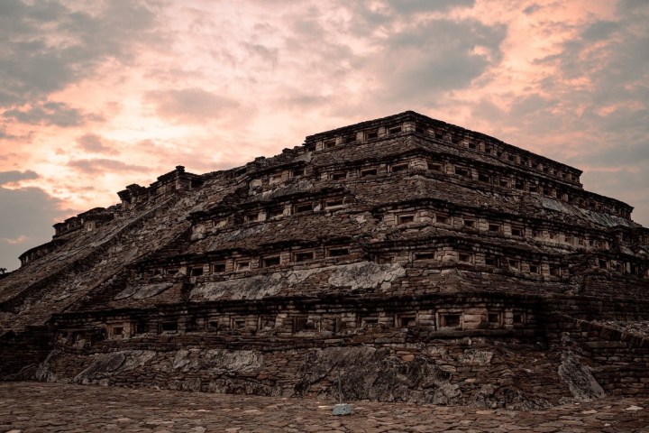 a building with a mountain in the background