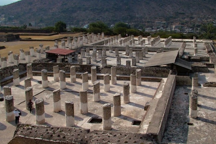 a building with a mountain in the background