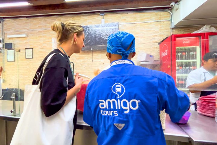 a group of people standing around a table