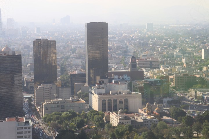 a large body of water with a city in the background