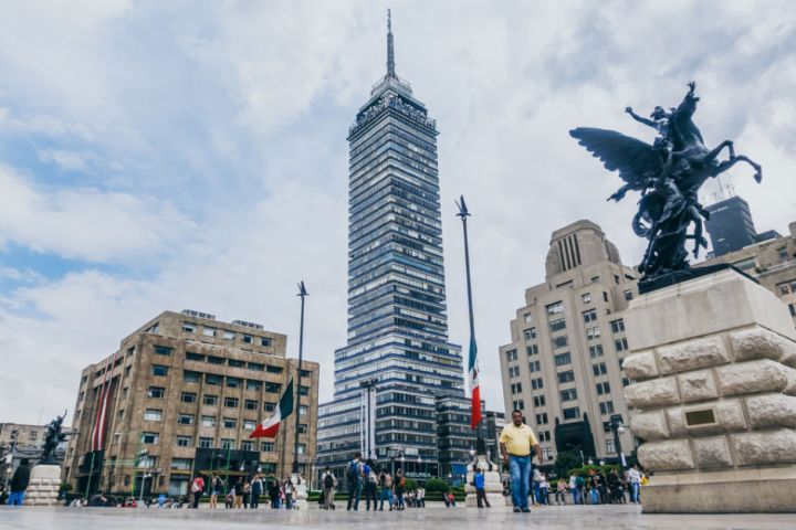 a group of people in front of a tall building