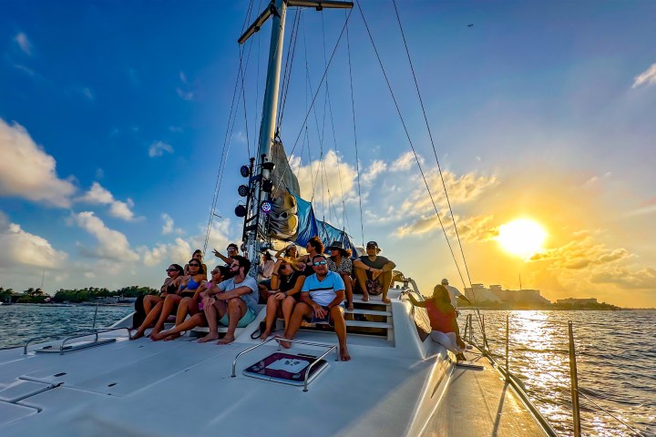 a group of people on a boat in the water