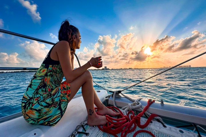a woman sitting at a beach