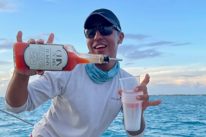 a person drinking water from a boat