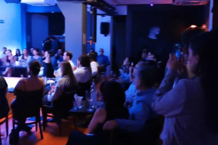 a group of people in a dark room