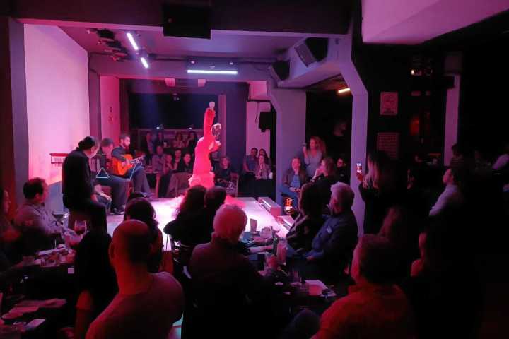 a group of people on a stage in front of a crowd