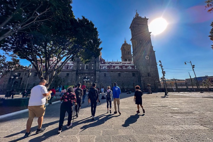 a group of people walking down the street