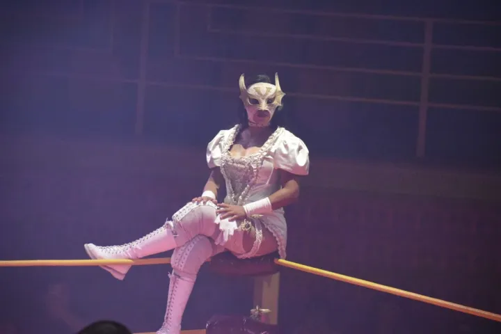 a woman holding an animal