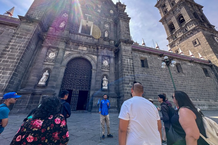 a group of people standing in front of a building