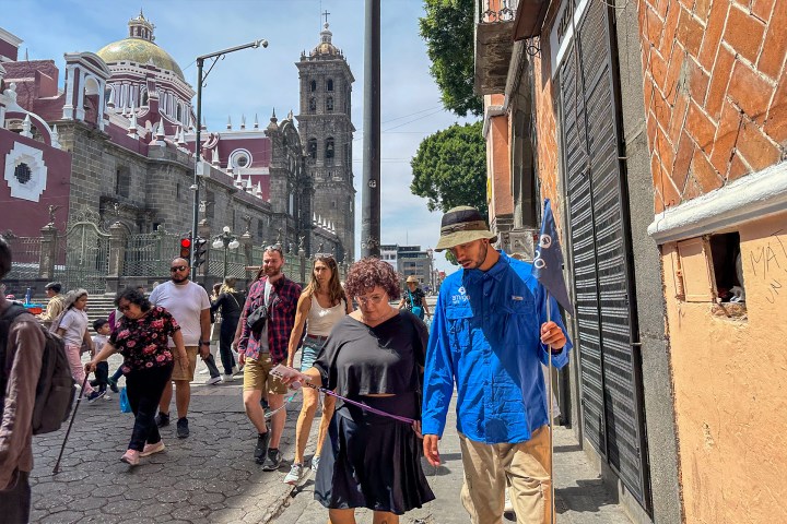a group of people walking down a street