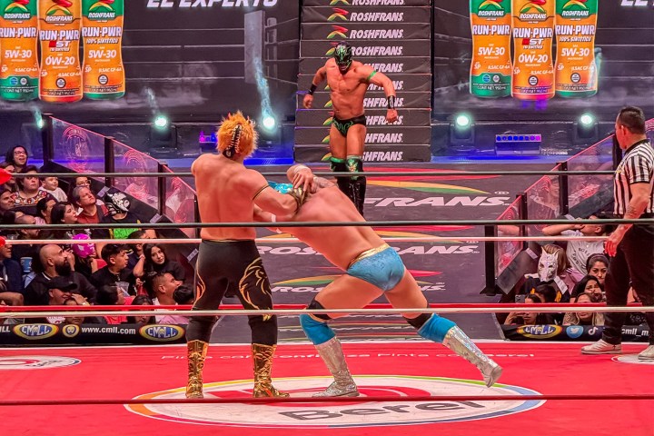 a group of people playing instruments and performing on a stage