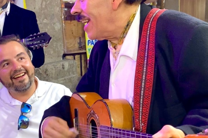 a man holding a guitar