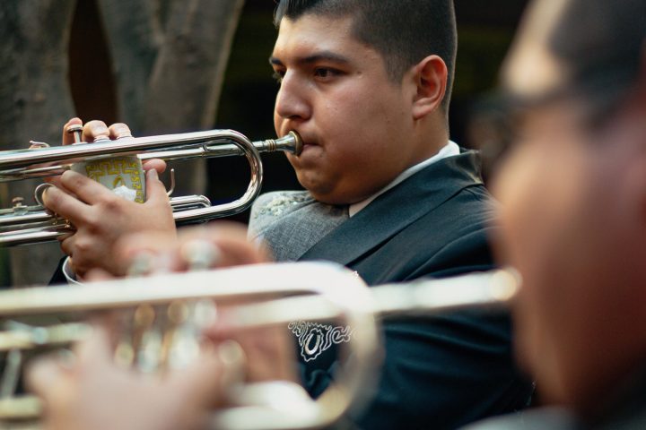 a close up of a person playing a guitar
