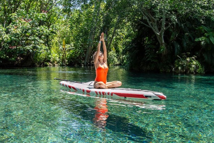 a person riding on the back of a boat in the water