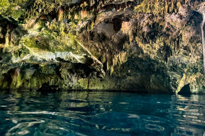 a large waterfall over some water