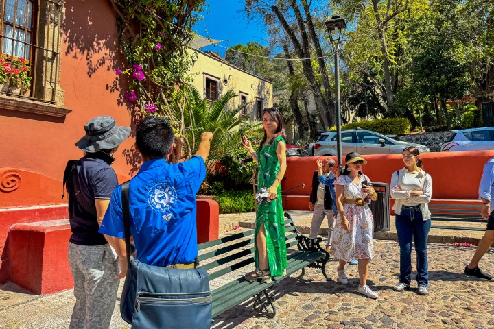 a group of people standing in front of a building