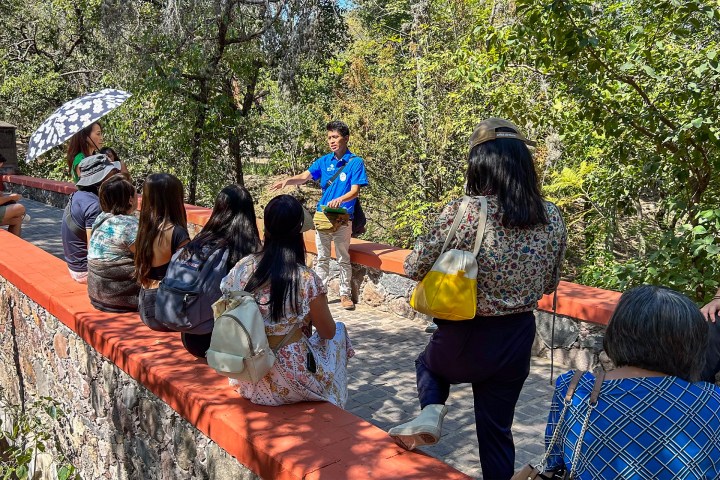 a group of people sitting at a park
