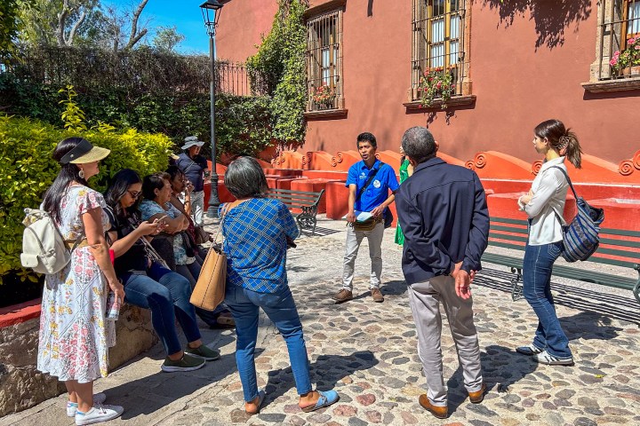 a group of people standing in front of a crowd