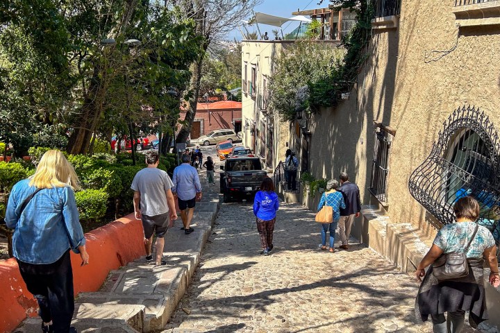 a group of people walking down the street