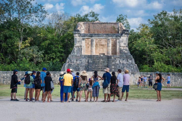 a group of people walking in front of a crowd