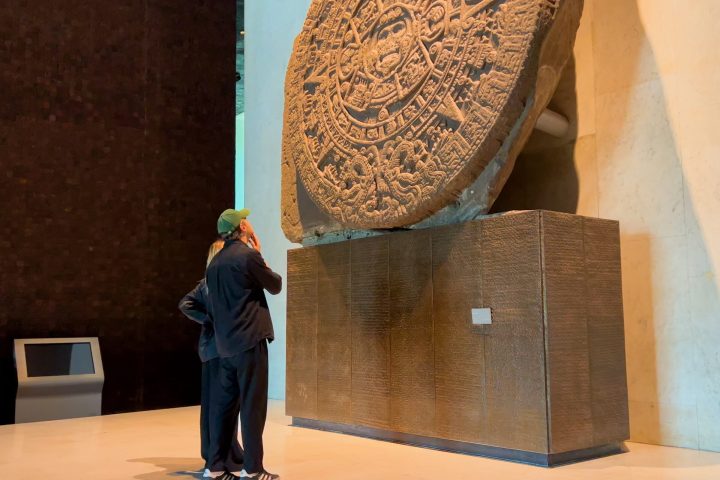 a person standing in front of a box