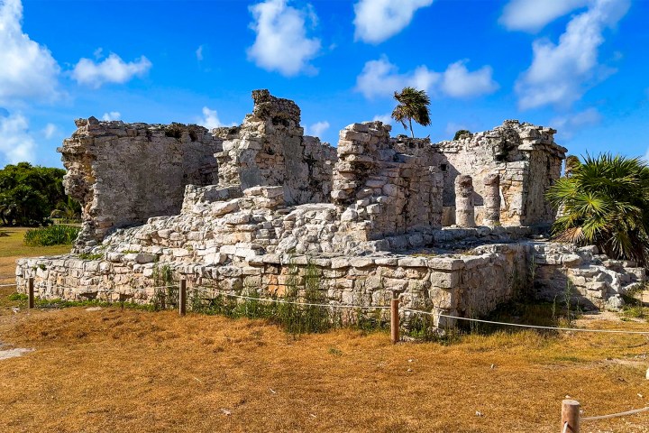 a castle on top of a grass covered field