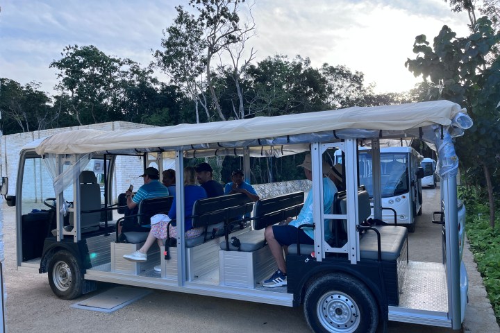 a group of people standing in front of a truck