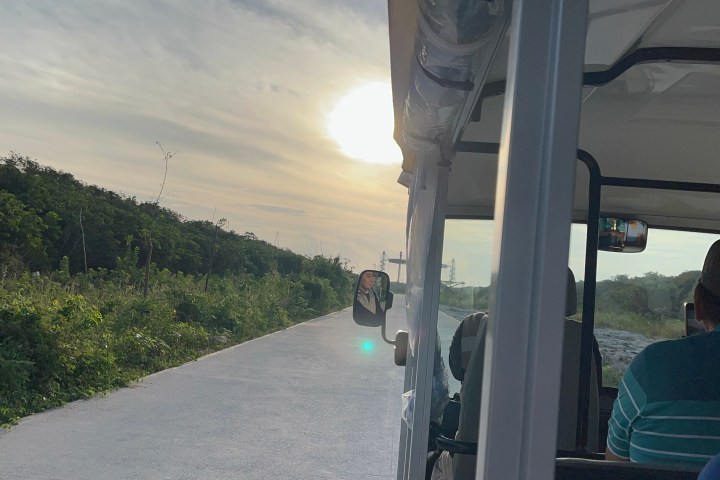 a person sitting on the side of a road