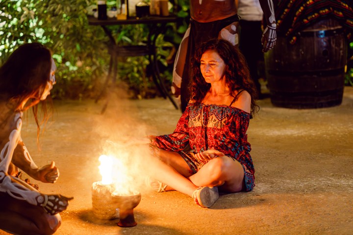 a person sitting on top of a fire