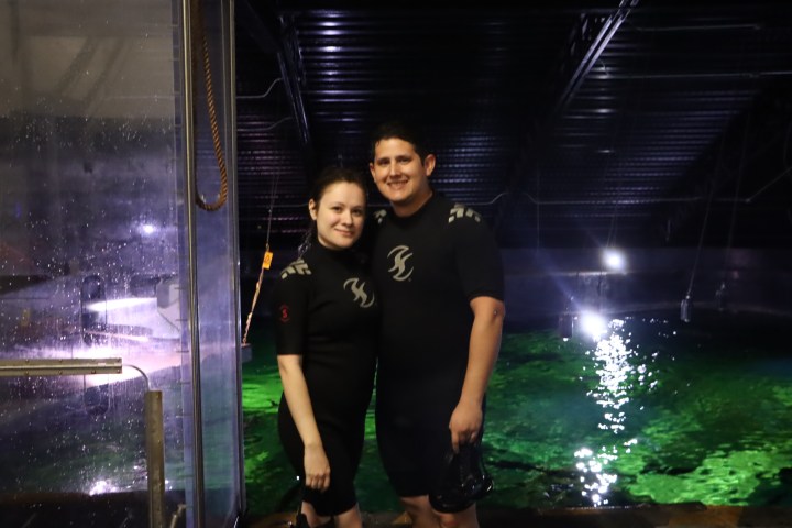 a person standing in front of a window posing for the camera