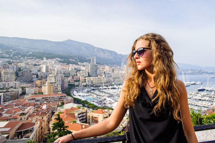a person standing in front of a mountain
