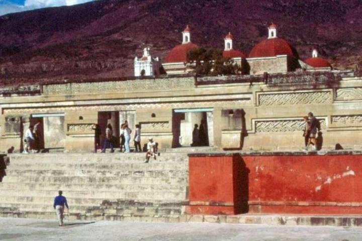 a group of people standing in front of a building