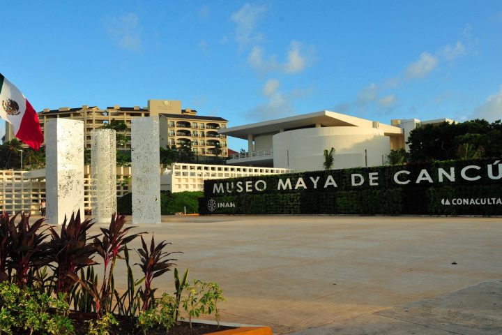 a sign in front of a building