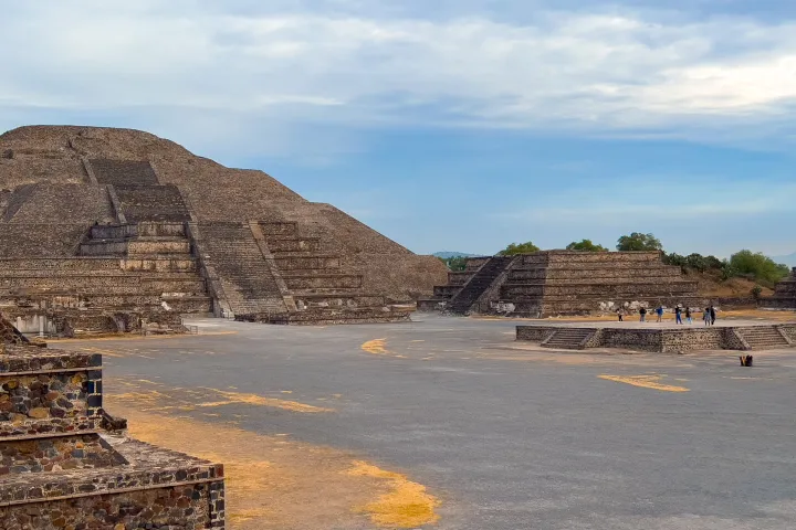 a body of water with a mountain in the background
