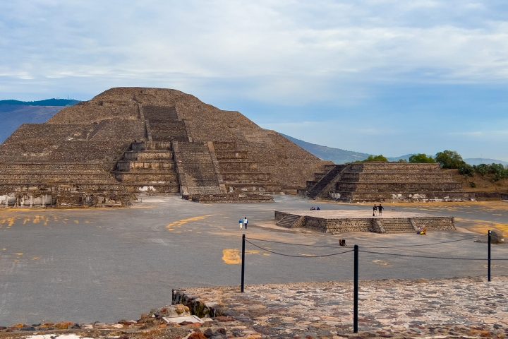 a body of water with a mountain in the background