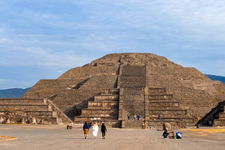 a group of people standing on top of a mountain